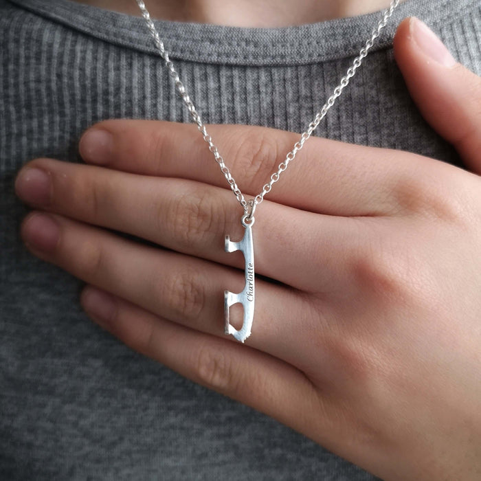 personalised silver ice skating necklace being worn