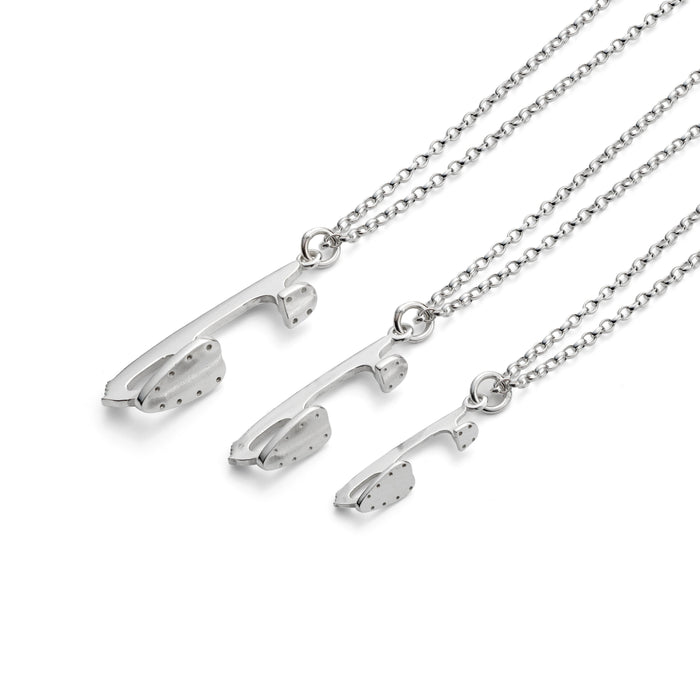 silver ice skating necklaces by Diana Greenwood Jewellery