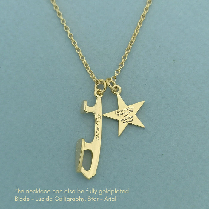 Gold necklace with a blade and star pendant on a teal background