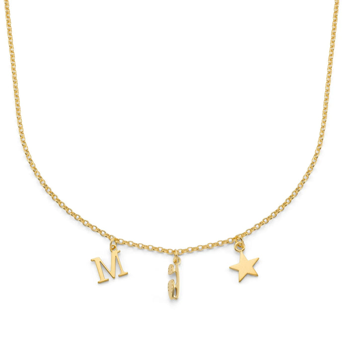 Gold necklace with 'M' , ice skate blade and star charms on a white background